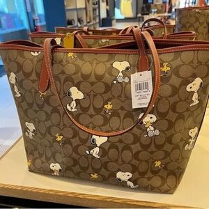 Coach X Peanuts City Tote In Signature Canvas With Snoopy Woodstock Print